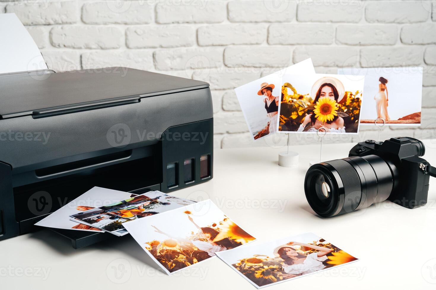 Printer and photo camera on table. Printing photos concept