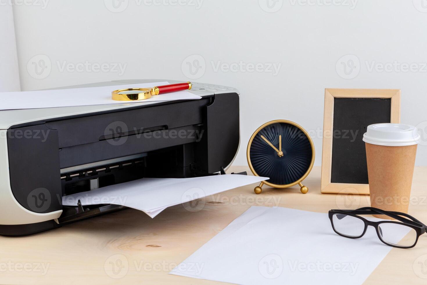 Office printer close up on a wooden table photo