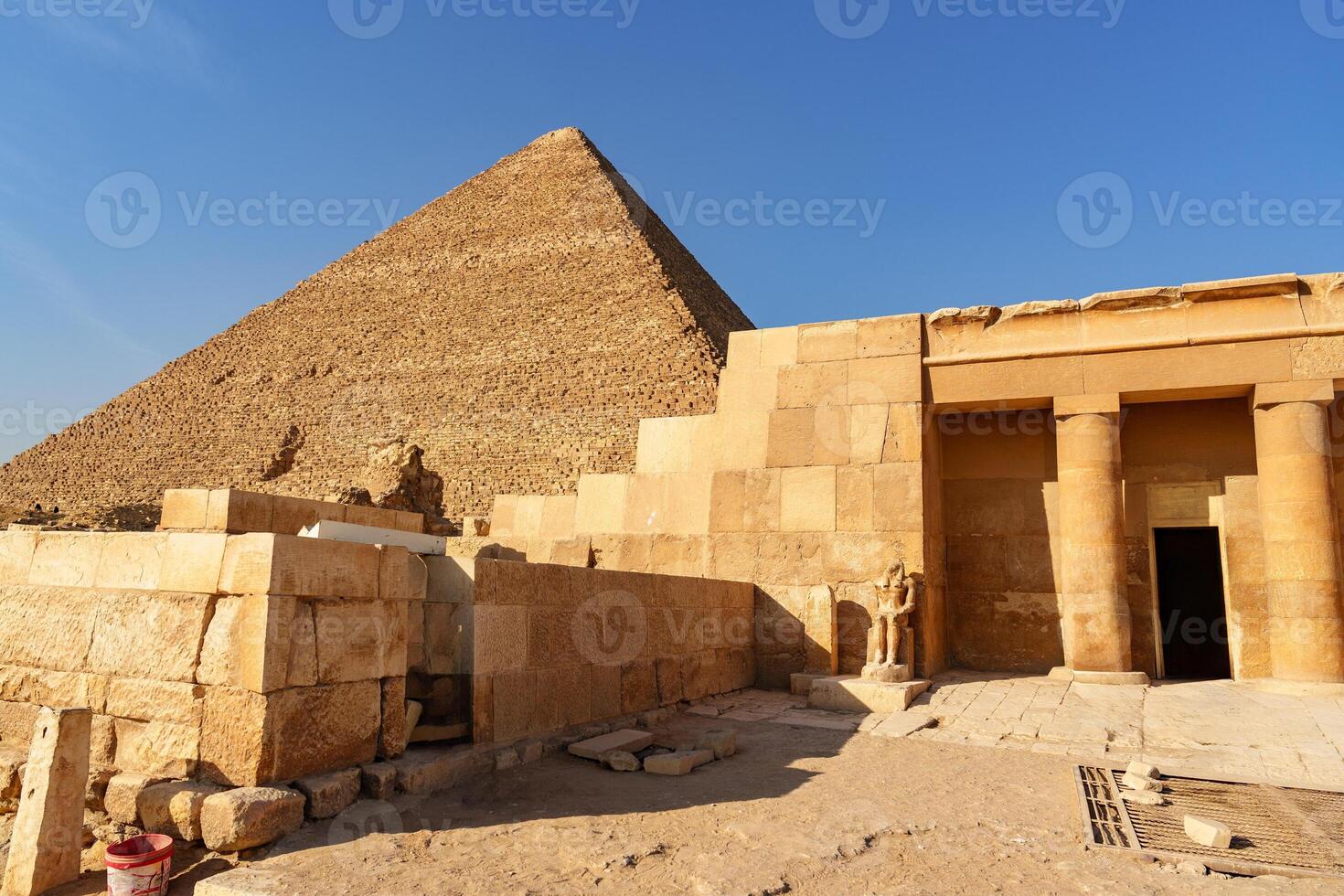 Exploring ancient pyramids and temples in Giza during the golden hour light photo