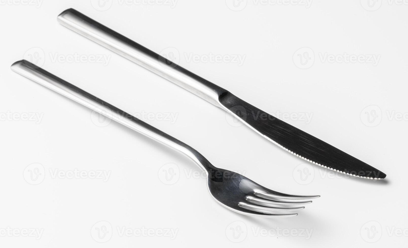 Fork and knife isolated on white background photo