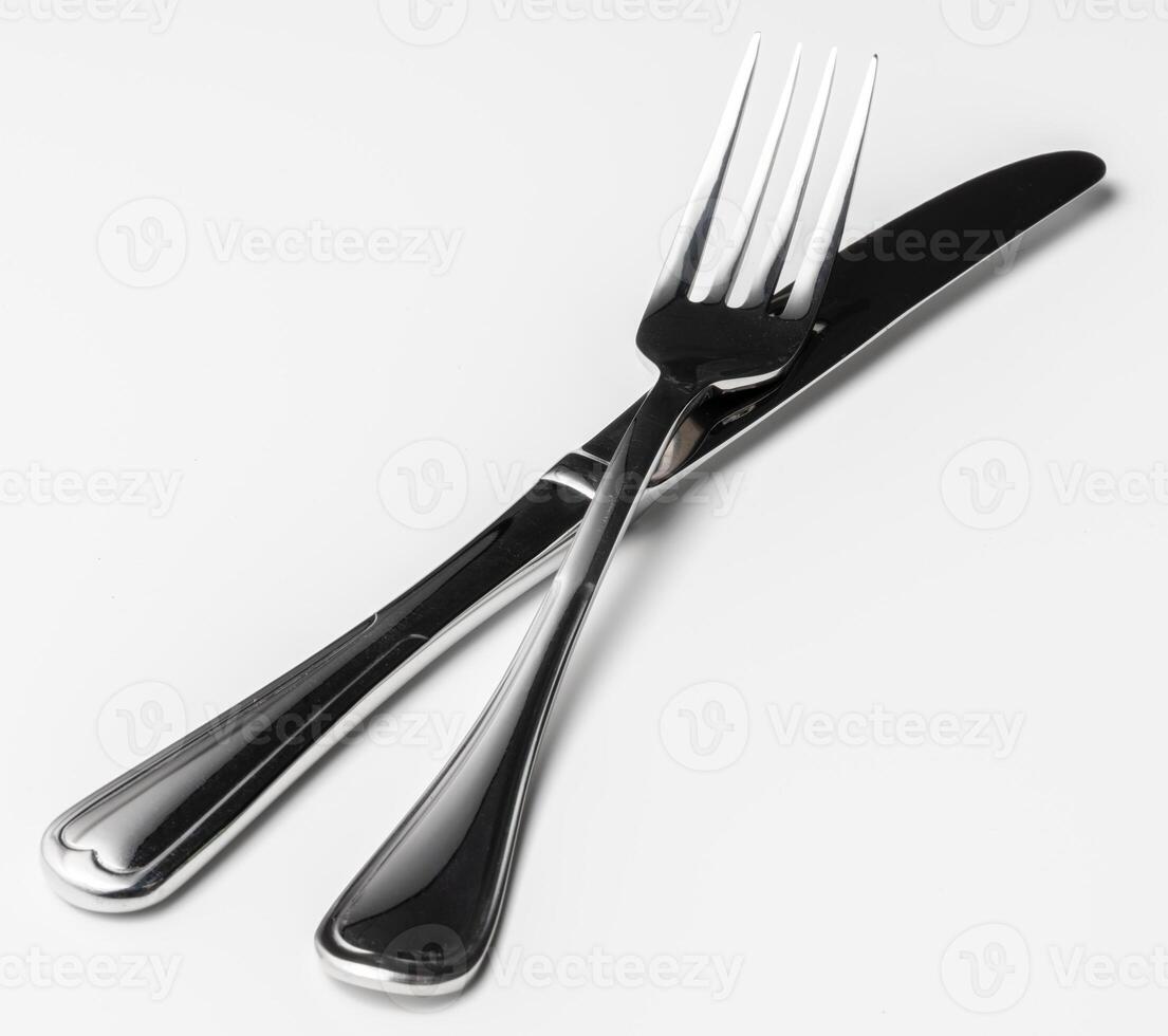 Fork and knife isolated on white background photo