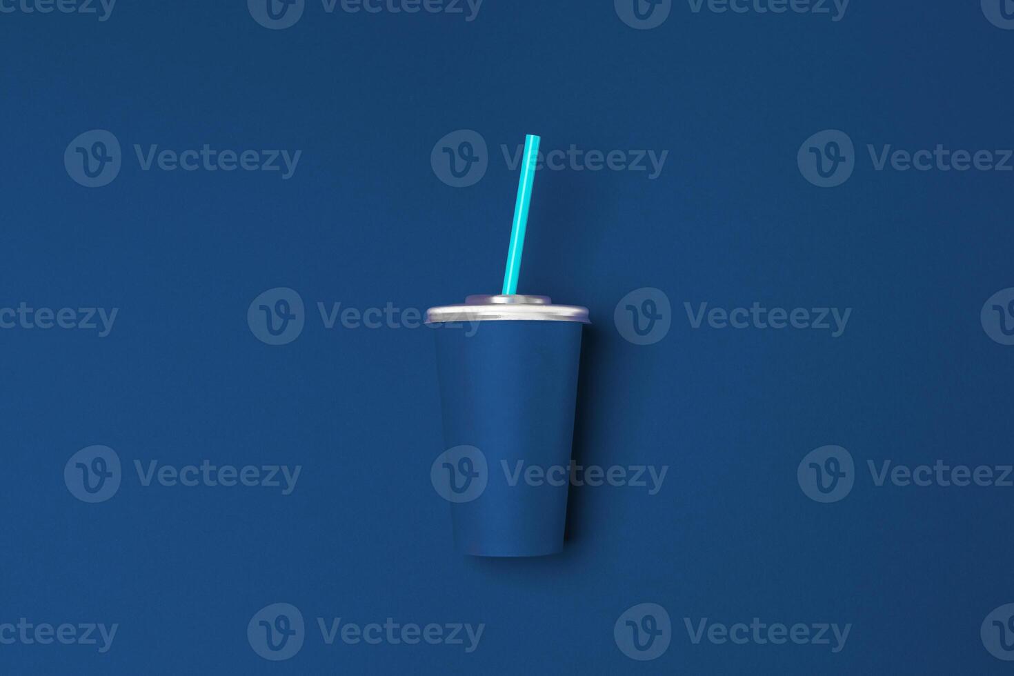 Take away cup on classic blue background top view photo