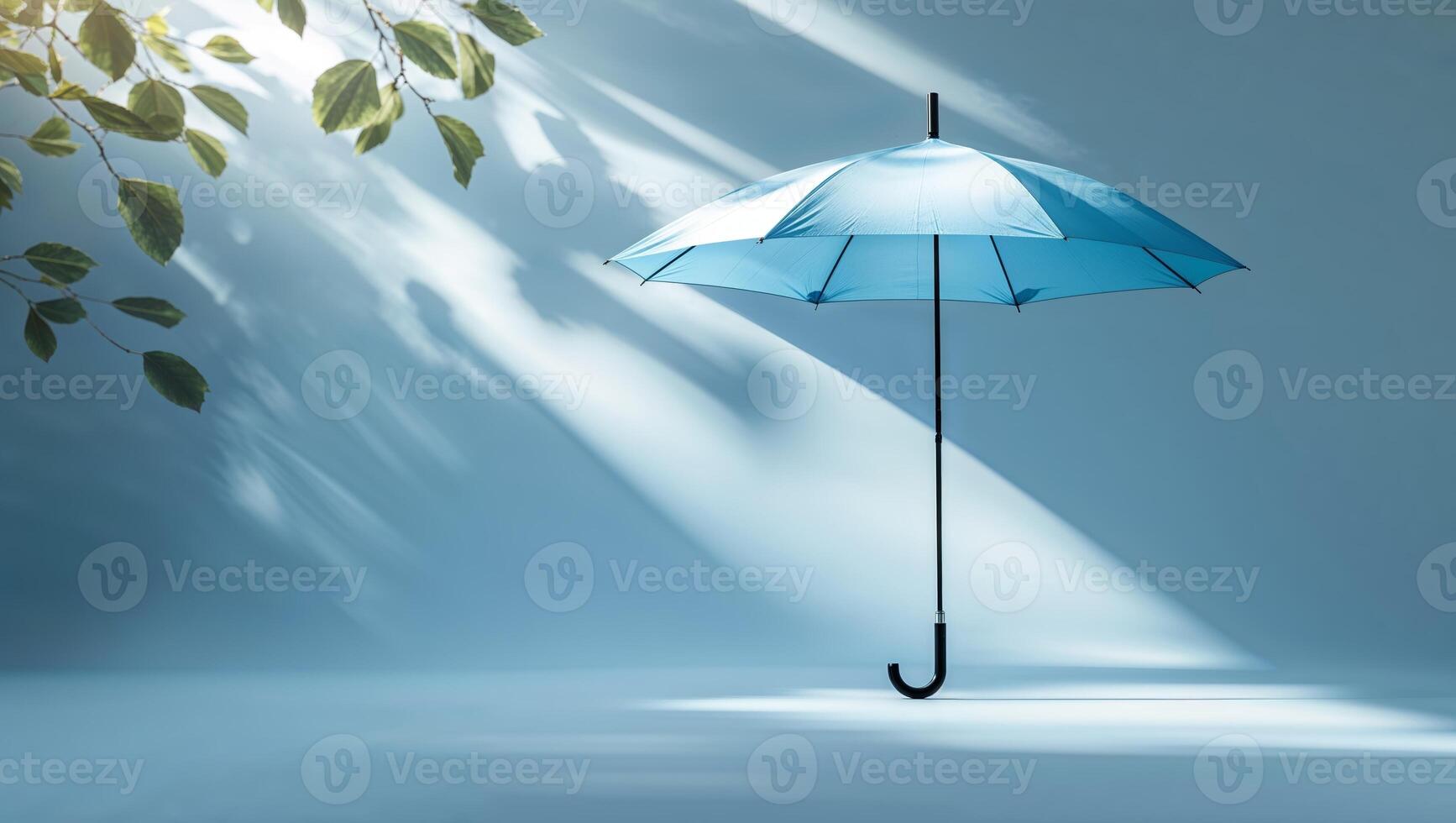 Blue umbrella stands out under soft light with subtle shadows and greenery in a tranquil setting photo