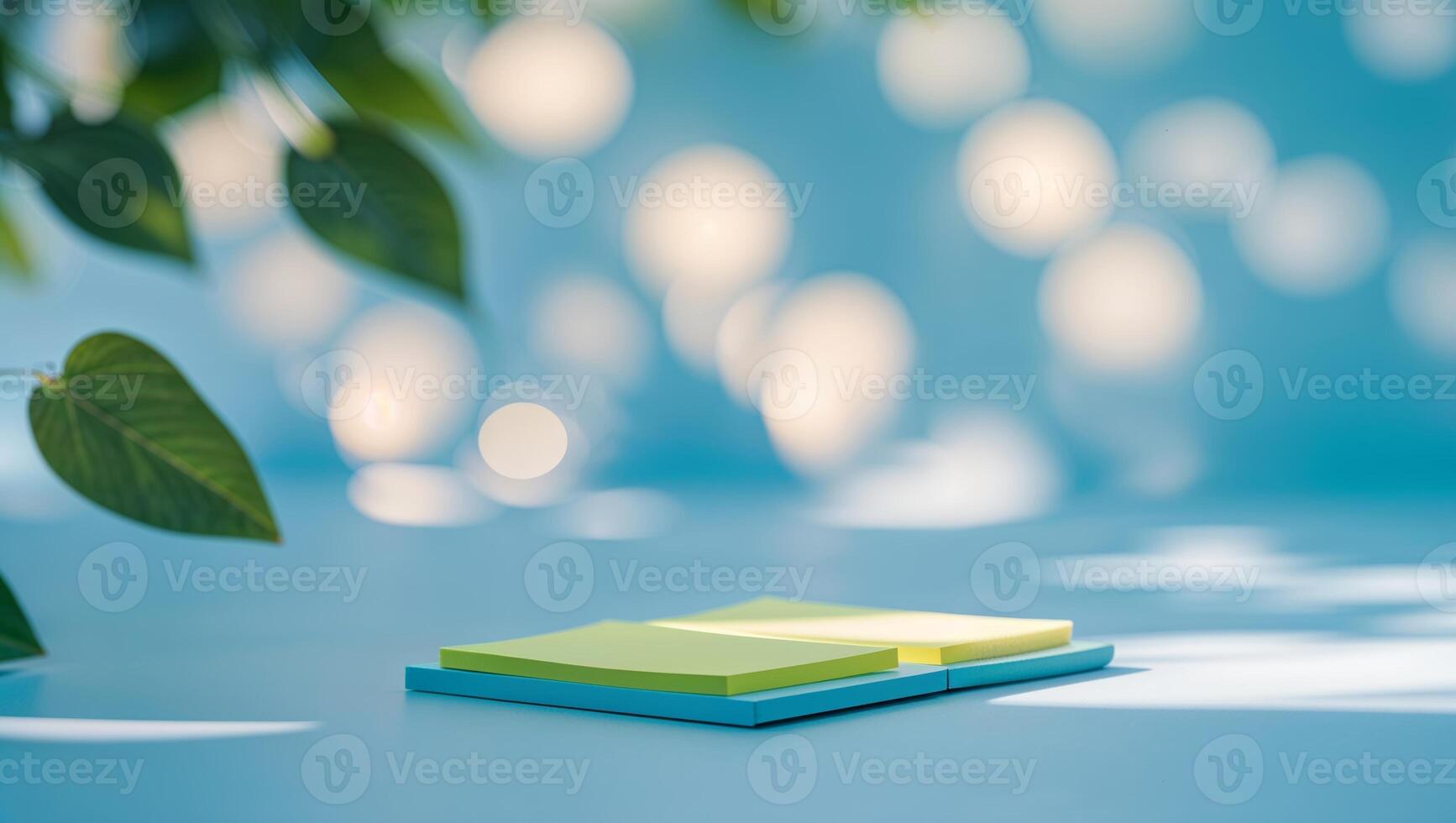 Colorful sticky notes on a blue surface surrounded by soft light during the afternoon photo