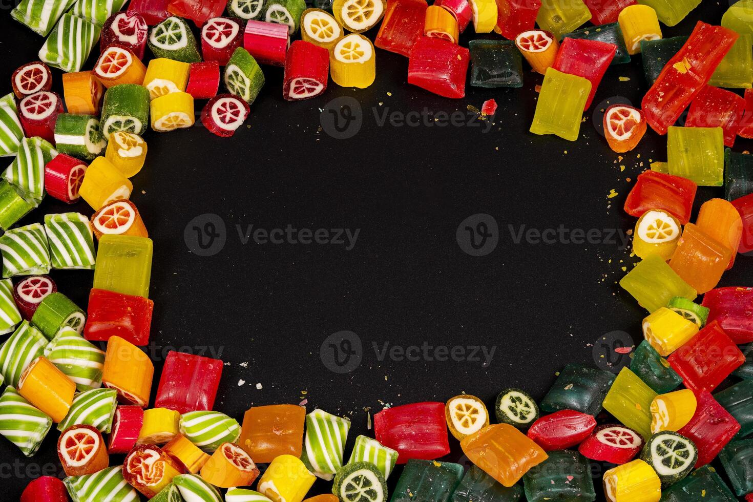 Colorful fruit-flavored candies arranged in vibrant circular pattern photo