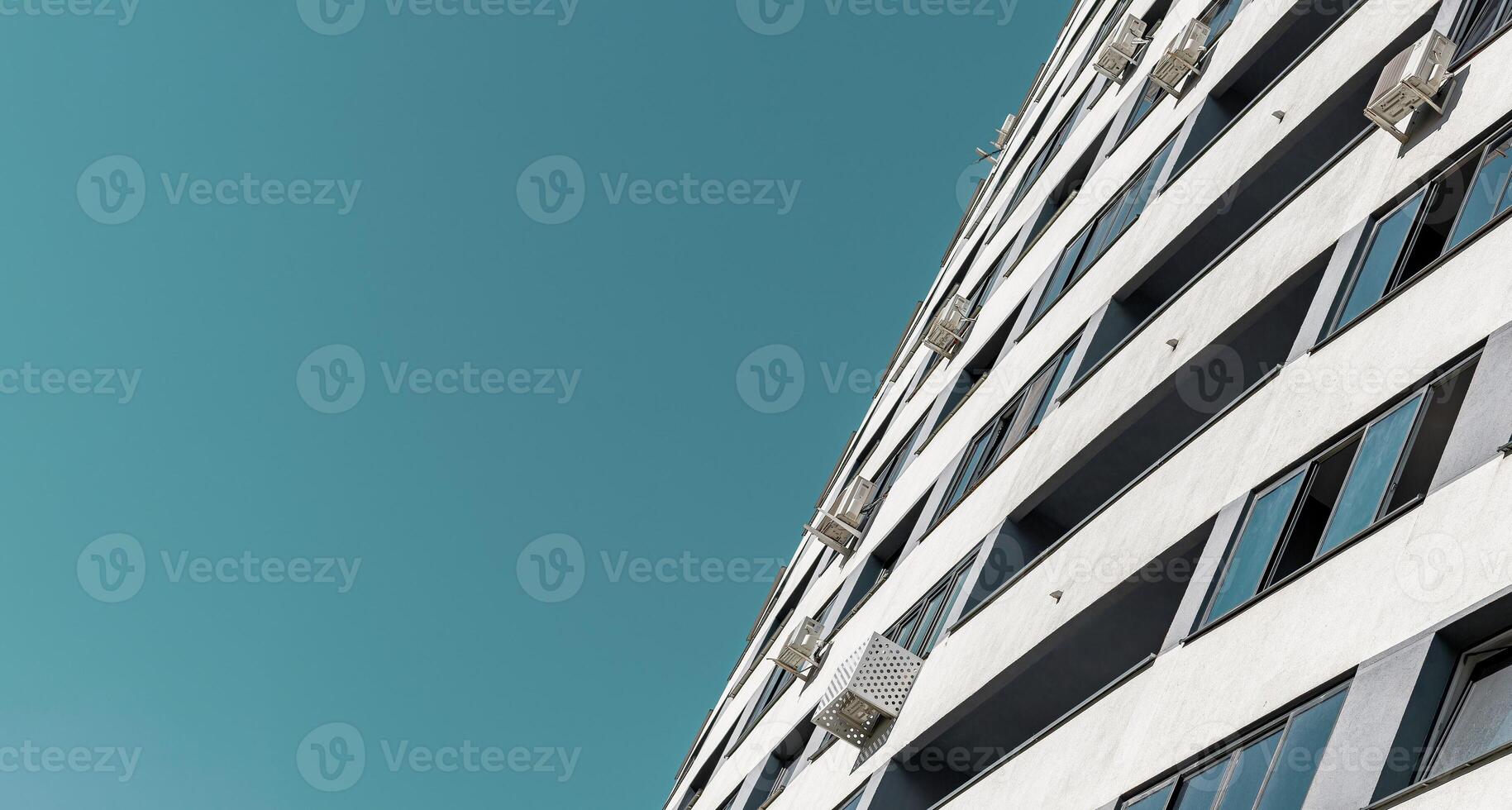 Modern multistorey apartment building in an urban neighborhood with efficient air conditioning and photo