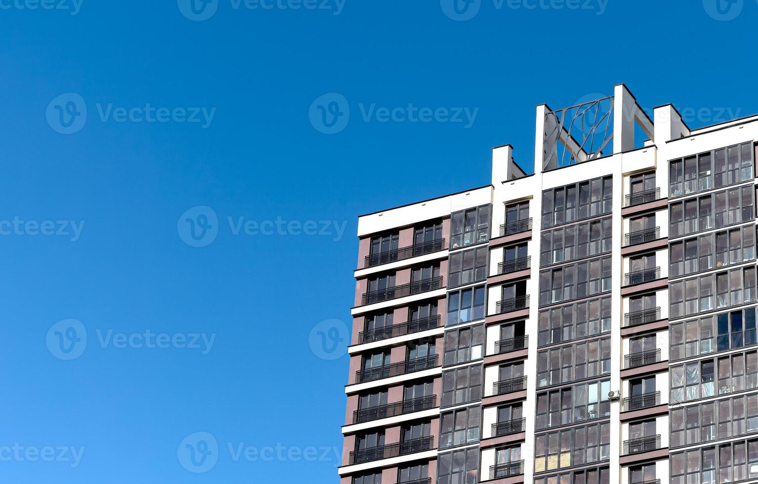 Modern condominium in a metropolitan city. Tall, high-rise building with a concrete facade, photo
