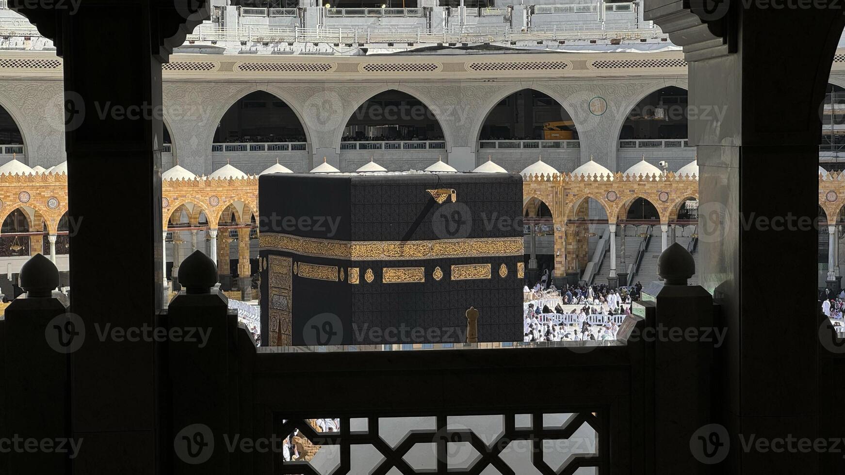 Muslim pilgrims perform Tawaf around the Kaaba after dawn prayer at Masjid al-Haram in Makkah, Saudi Arabia. Muslims worldwide face the Kaaba in prayer, symbolizing unity and devotion in Islam photo