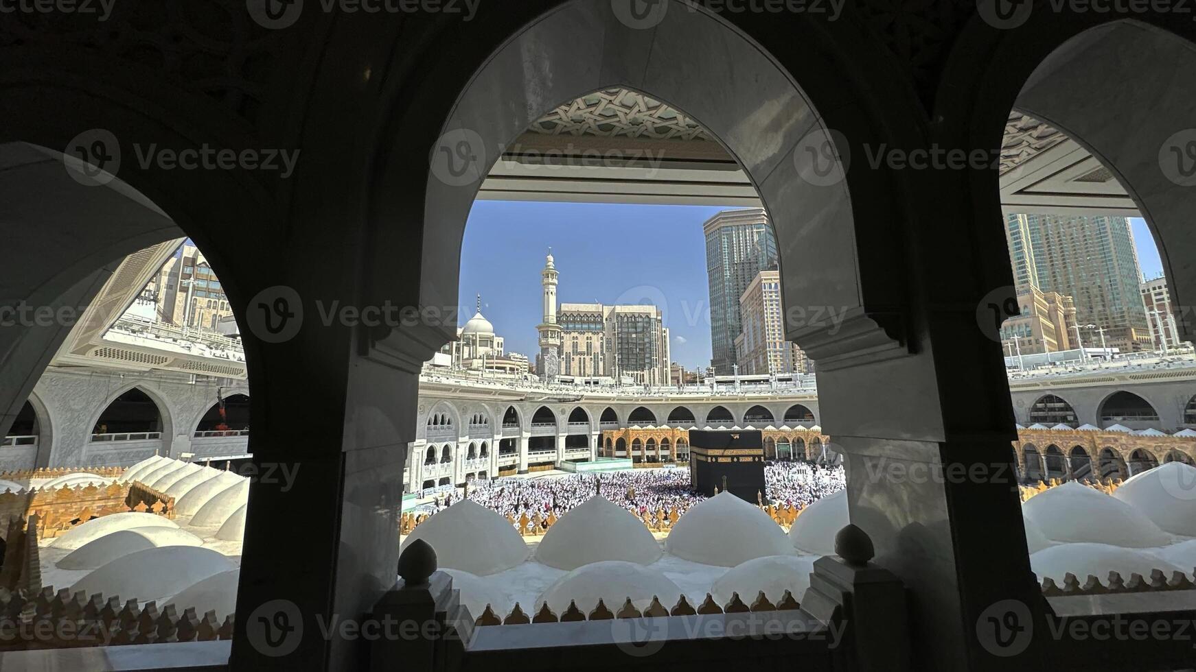 Muslim pilgrims perform Tawaf around the Kaaba after dawn prayer at Masjid al-Haram in Makkah, Saudi Arabia. Muslims worldwide face the Kaaba in prayer, symbolizing unity and devotion in Islam photo