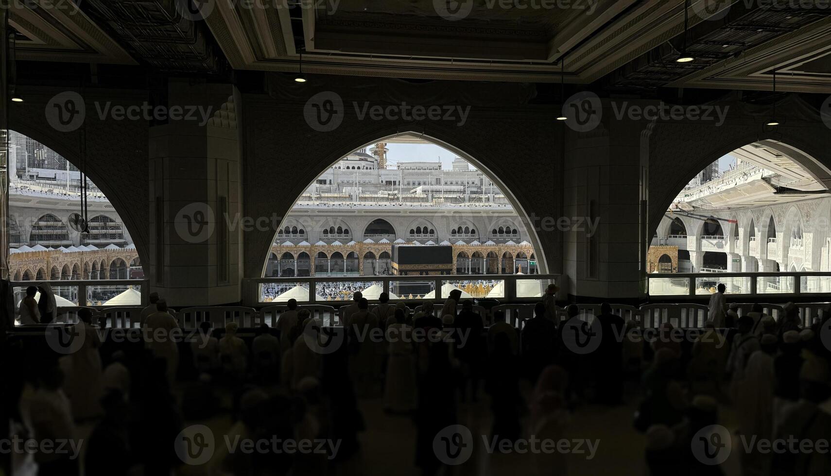 Muslim pilgrims perform Tawaf around the Kaaba after dawn prayer at Masjid al-Haram in Makkah, Saudi Arabia. Muslims worldwide face the Kaaba in prayer, symbolizing unity and devotion in Islam photo