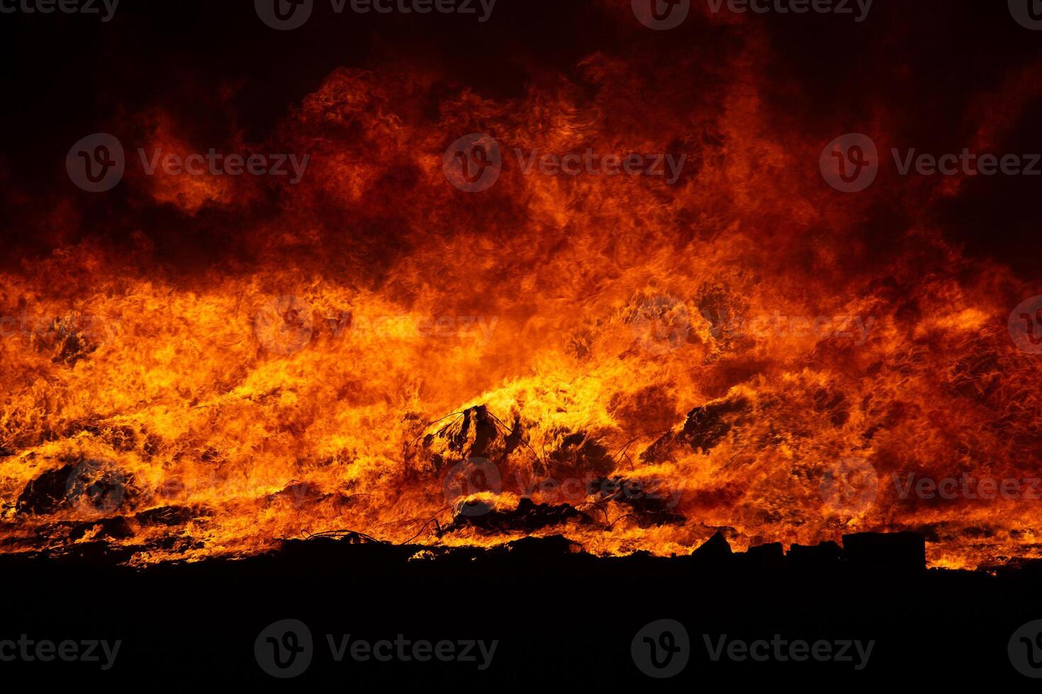 Big blaze and smoke at night. photo