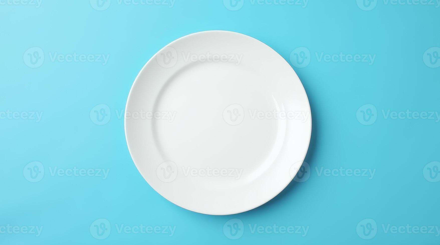 Empty white round plate on blue background. Minimalist tableware, dining, food presentation, restaurant, and kitchen concept photo