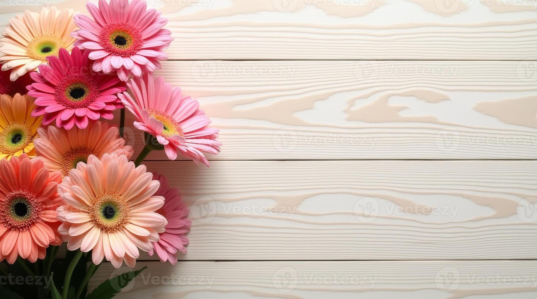Pink and peach gerbera flowers on light wooden background with copy space. Flat lay composition for greeting card, invitation, poster photo