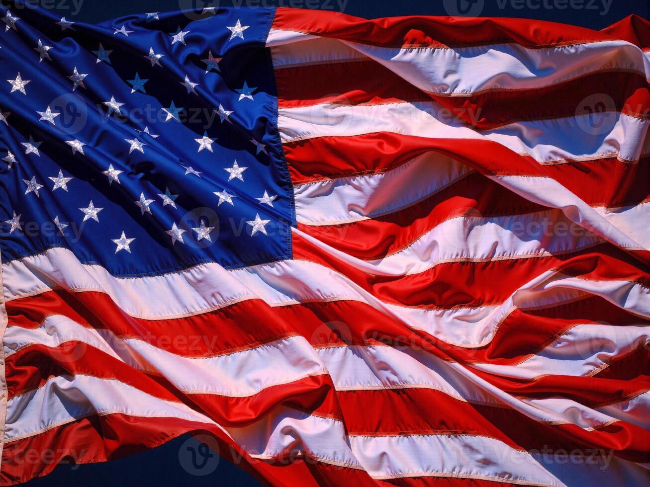 An american flag is blowing in the wind photo