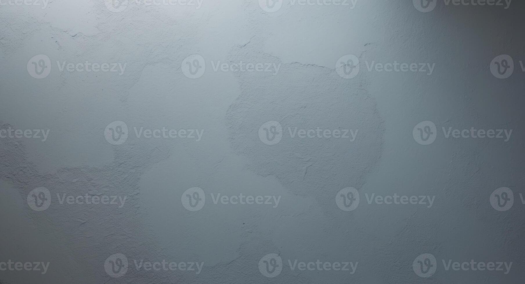 top view of a smooth matte gray wall texture with small roughness and fine particles scattered across the surface. photo