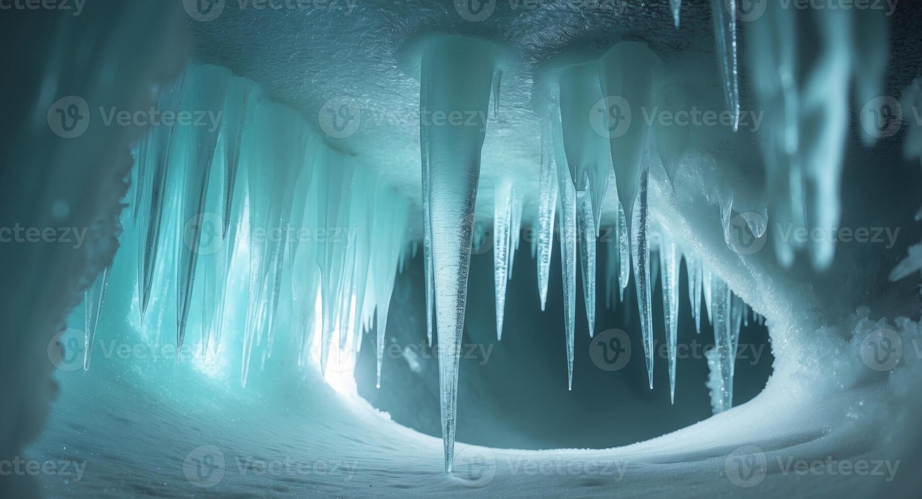 Mystical Ice Cave with Glowing Blue Light and Icicles Hanging Down photo