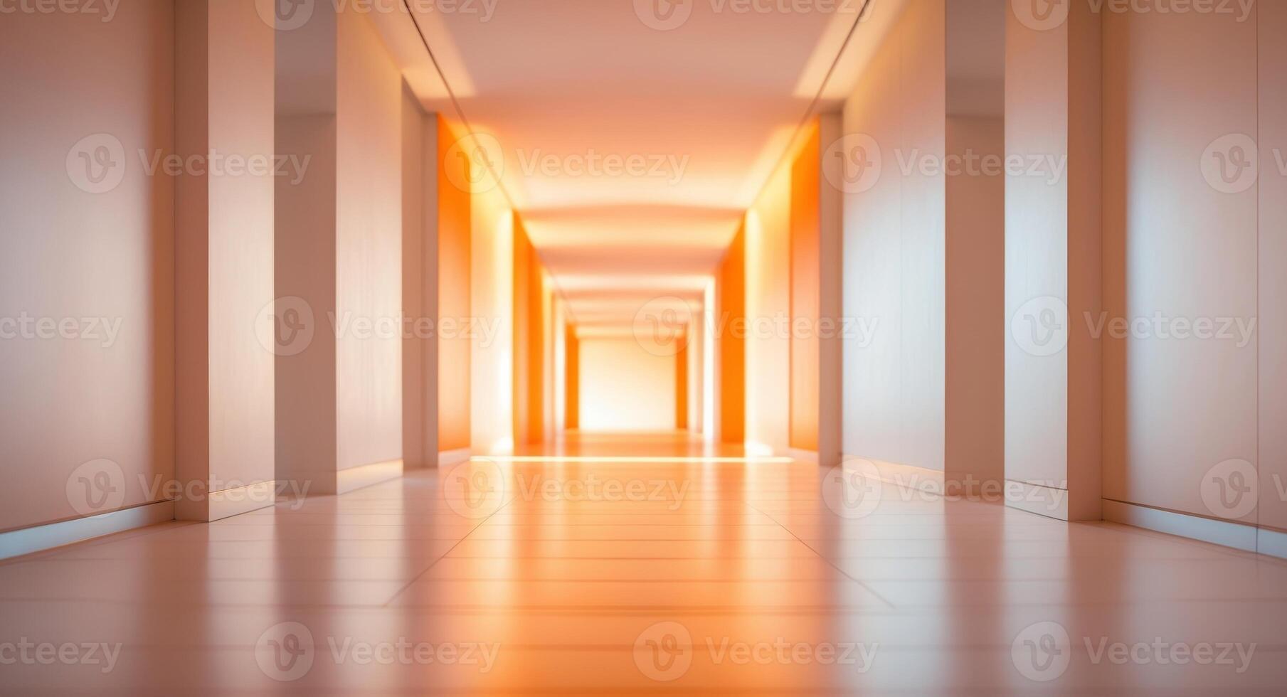 A long hallway with orange light coming from the ceiling photo