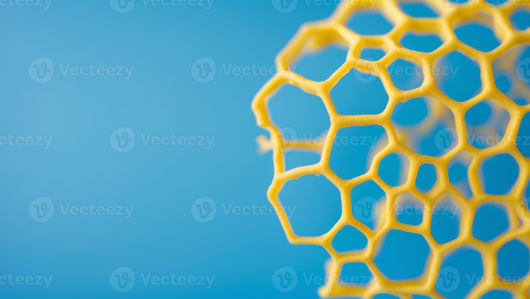 Abstract Yellow Honeycomb Texture on Bright Blue Background photo