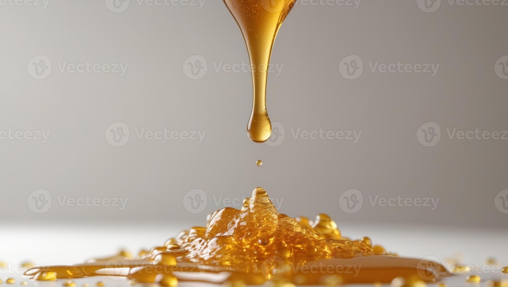 Honey dripping from a spoon on a white background photo