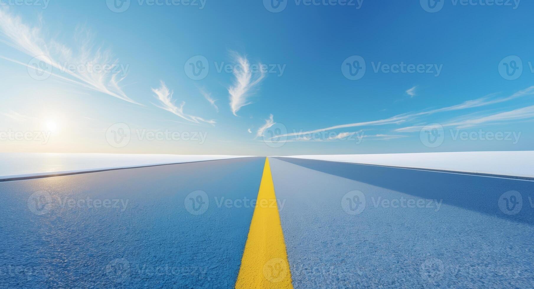 An empty road with a yellow line on it photo