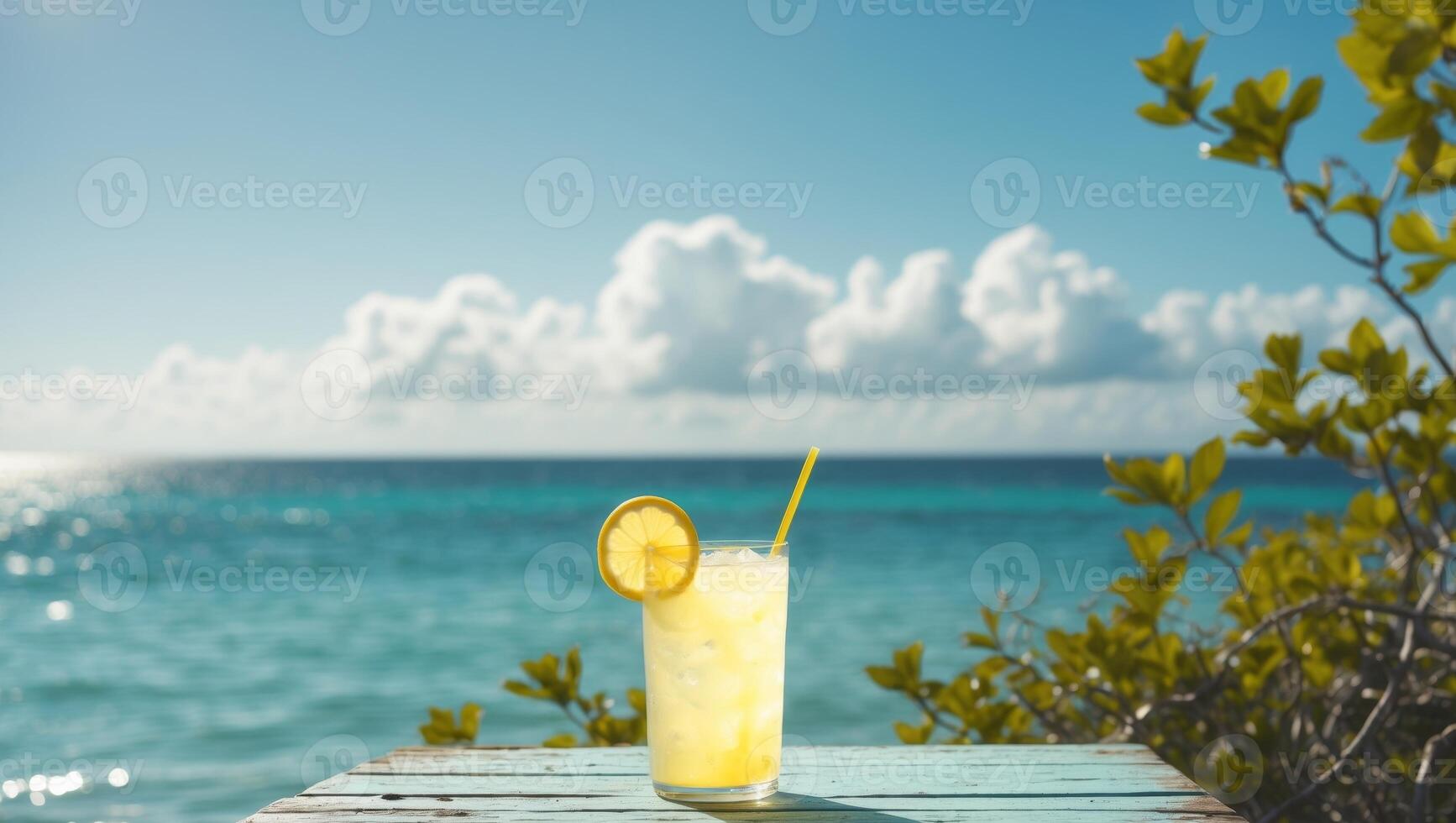 Refreshing lemonade drink on wooden table by the seaside in bright sunny weather photo