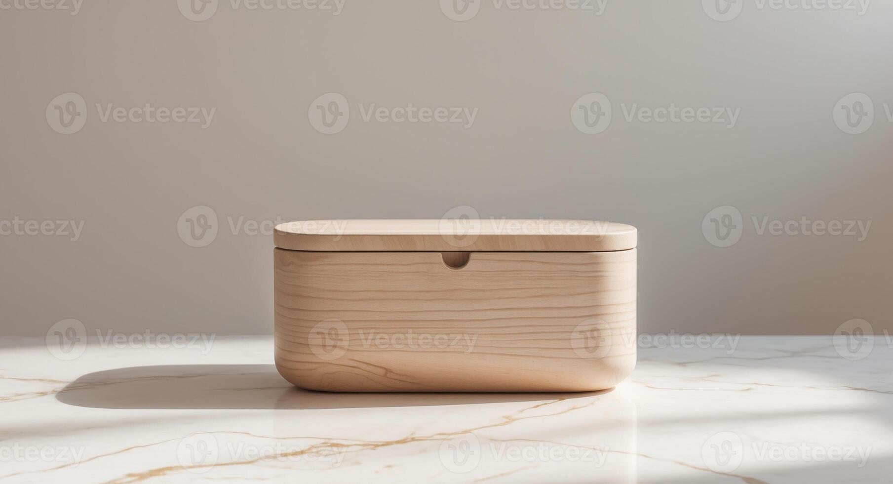 Modern wooden storage box with rounded edges on marble surface photo