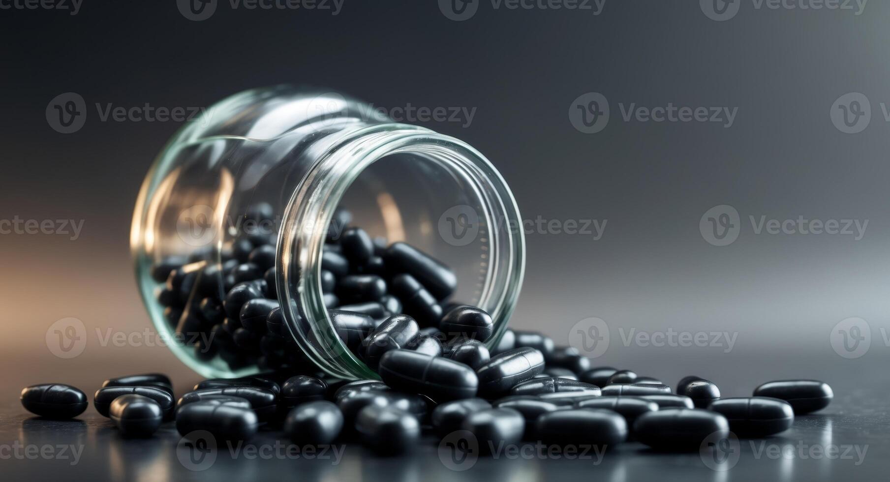 Black Round Pills Overflowing from a Glass Jar on a Dark Surface. photo