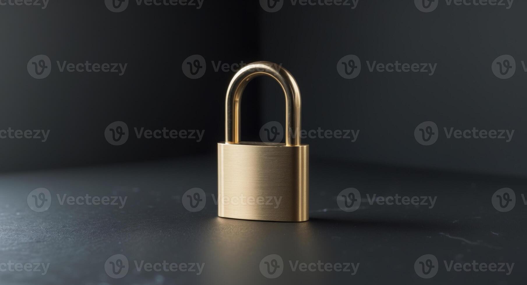 Golden padlock resting on a black surface symbolizing security and protection concepts photo
