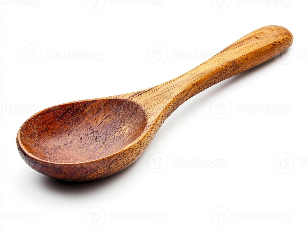 Wooden spoon on a white background for cooking and serving photo