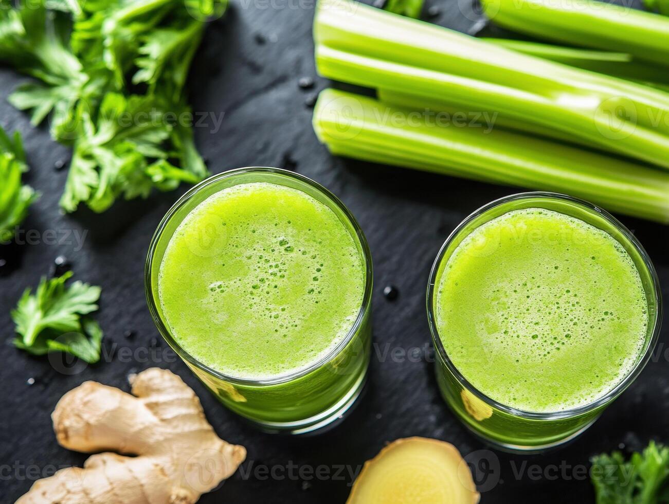 Refreshing green juice made with celery and ginger in kitchen photo