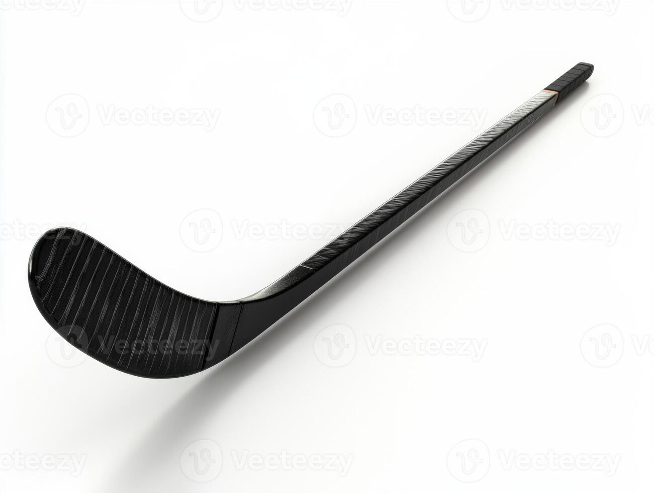 Hockey stick resting on a surface displaying its details photo
