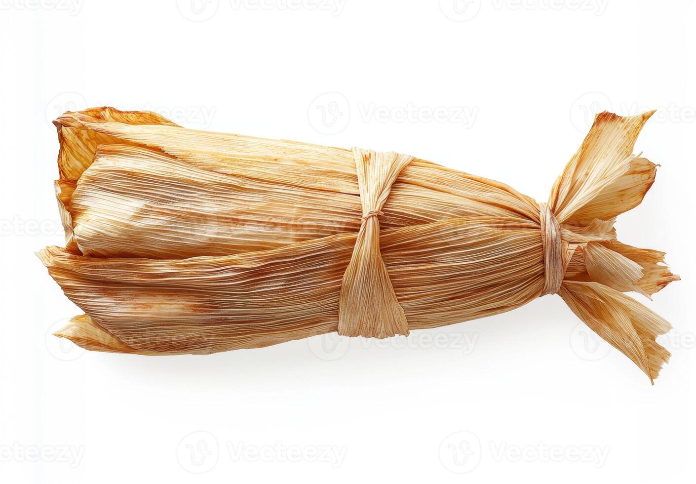 Delicious traditional tamale wrapped in corn husk ready to be served photo