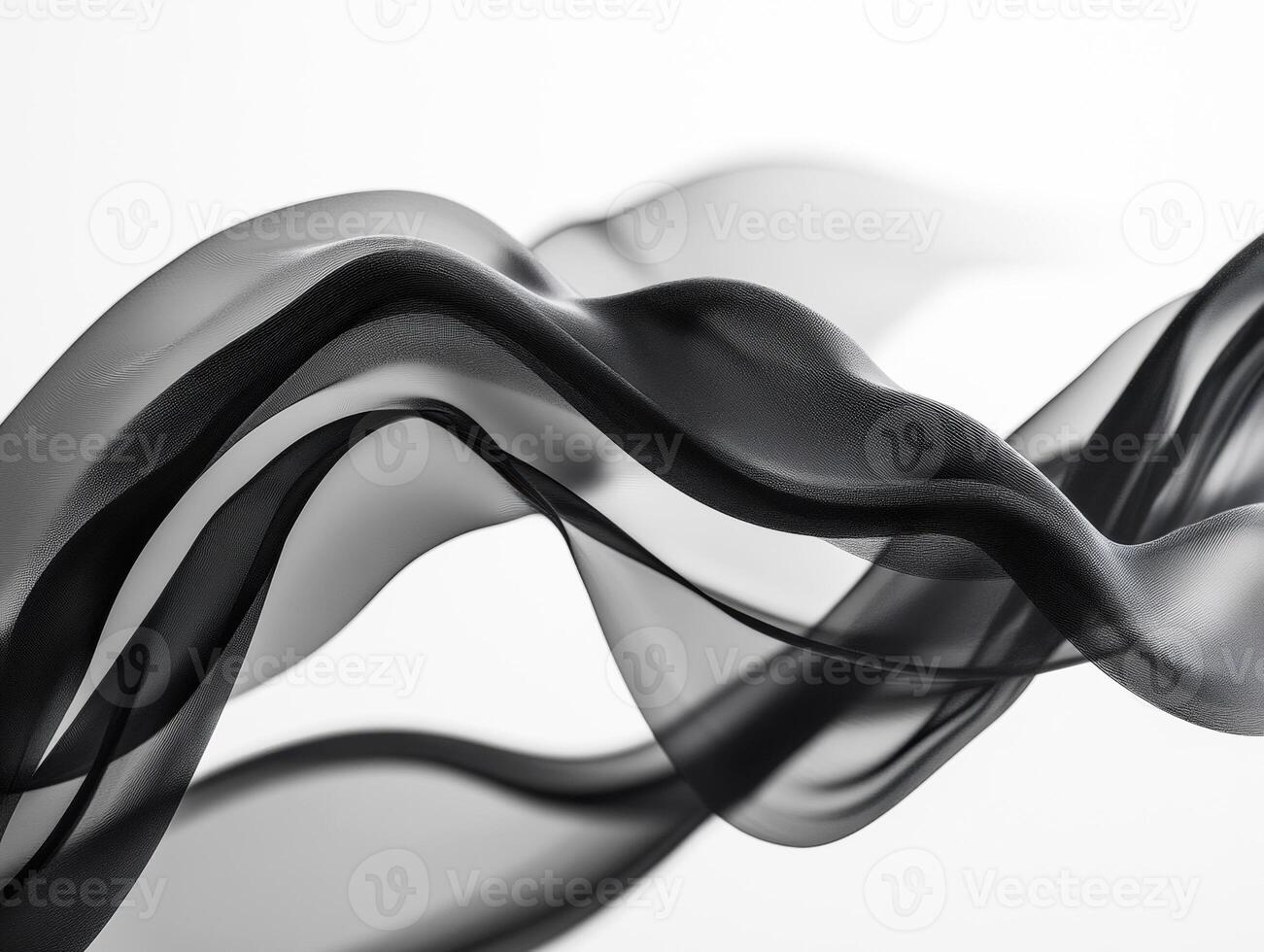 Black fabric forms elegant patterns on a light backdrop photo