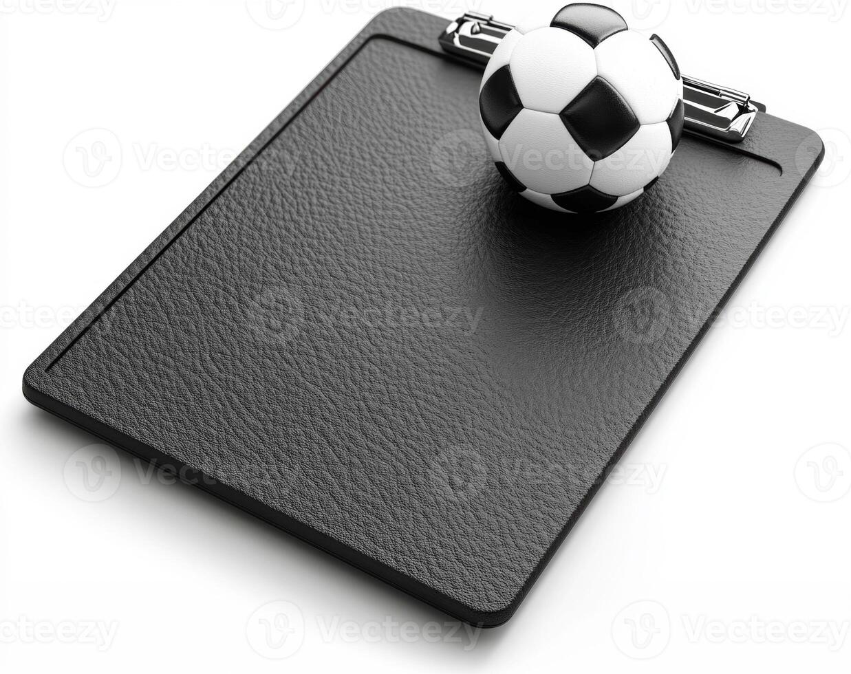 Clipboard and small soccer ball on a black surface for coaching photo