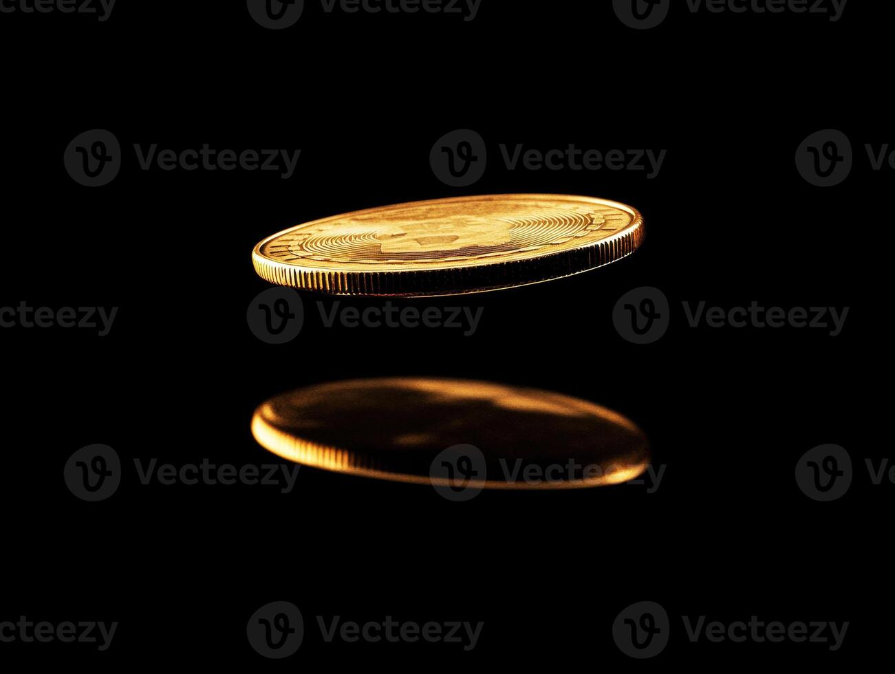 Golden coin spinning in mid-air with reflection on surface photo
