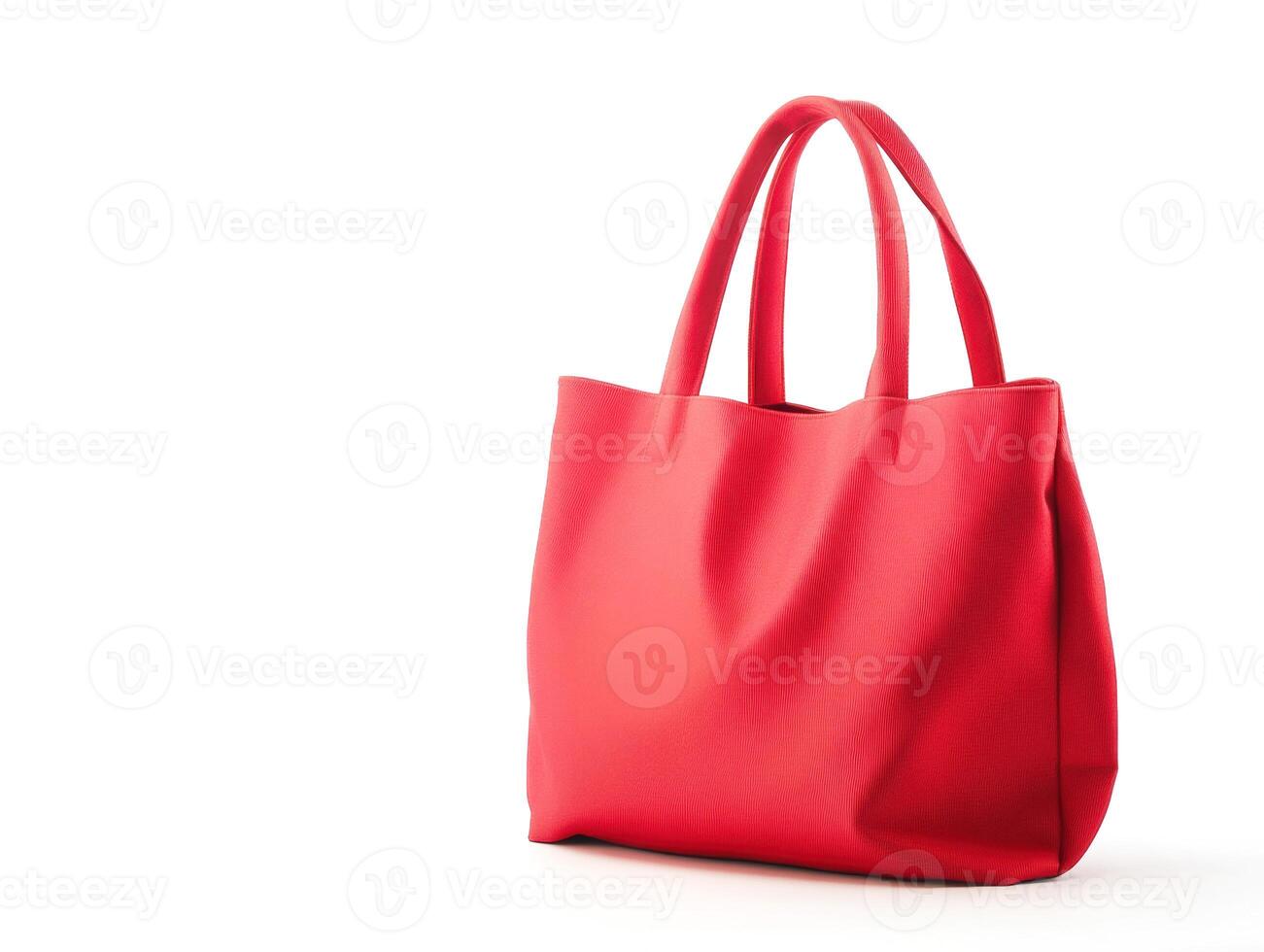 Stylish red handbag placed on a plain background photo