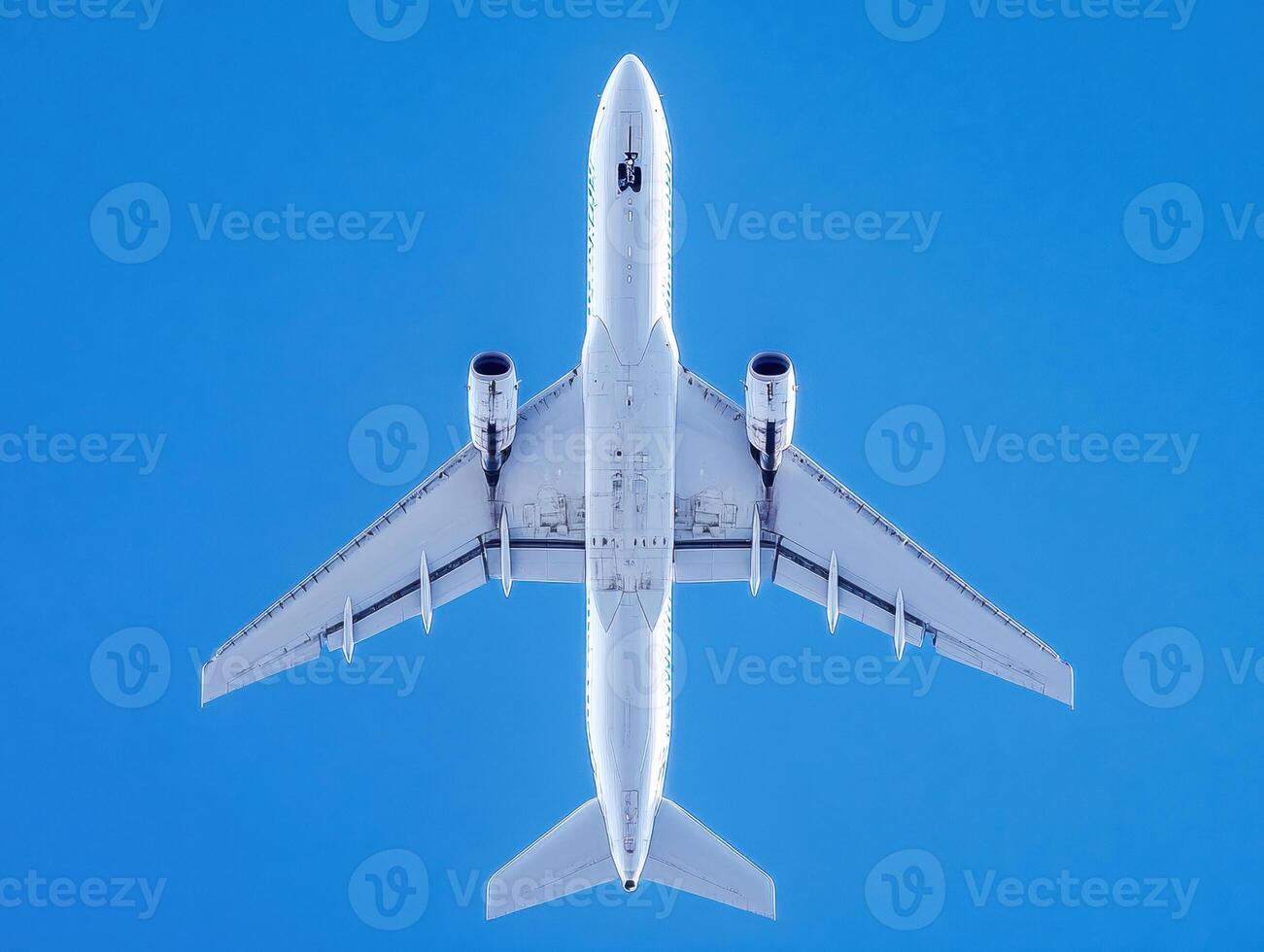 Airplane flying high in a clear blue sky during daytime photo