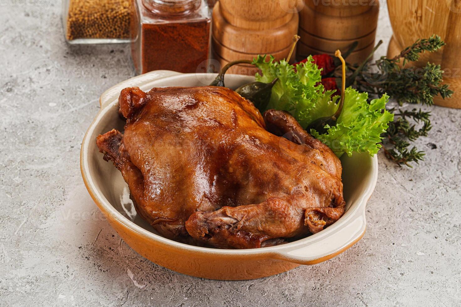 A bowl of chicken with vegetables and spices photo