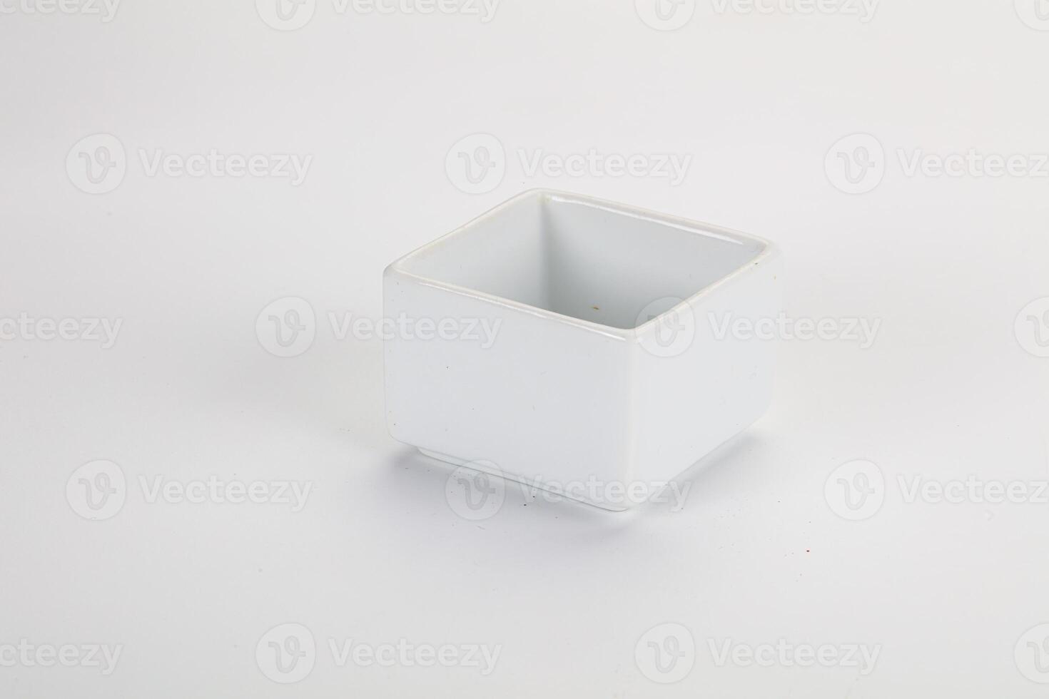 A white square container with a small lid photo