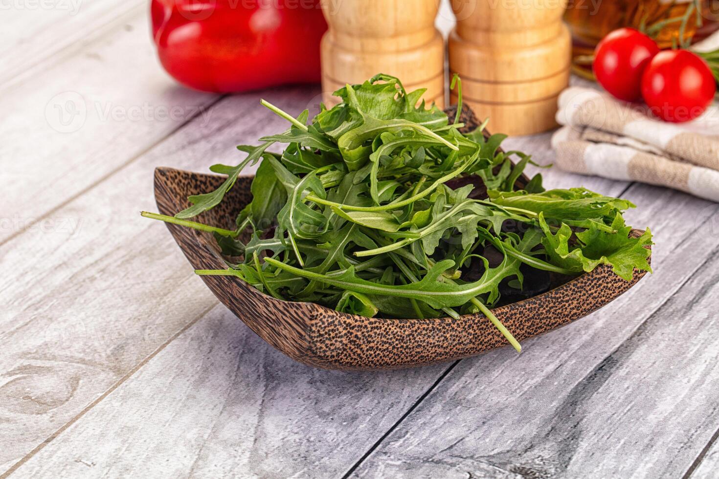 A bowl of greens on a table photo