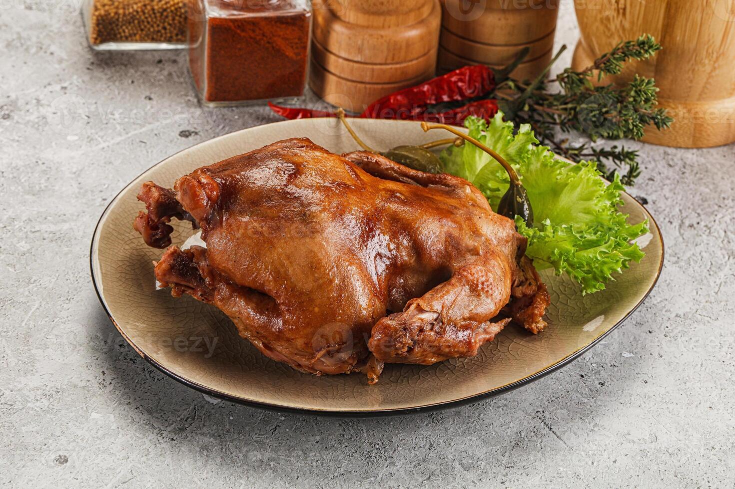 Chicken on a plate with vegetables and spices photo