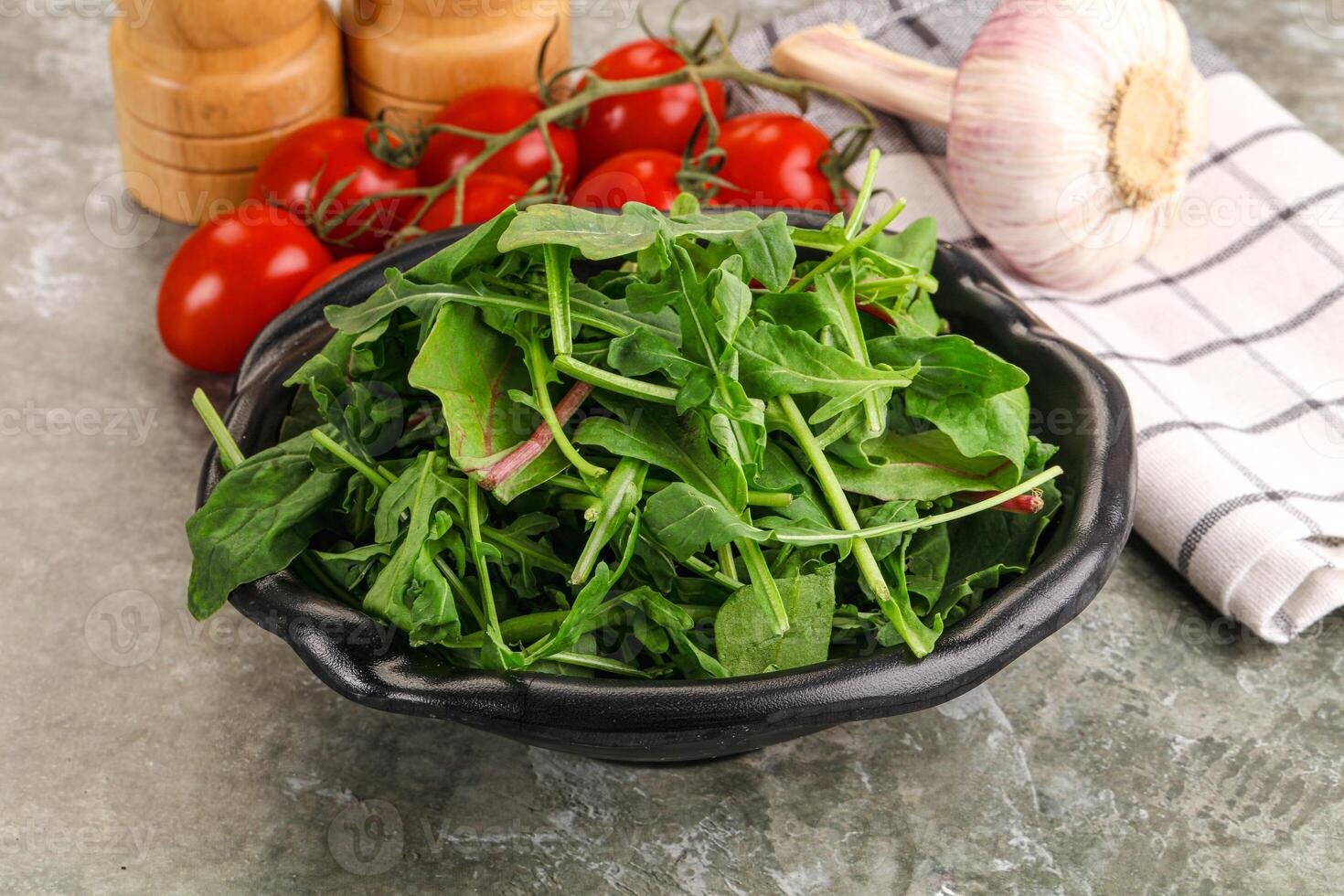 Fresh spinach salad with tomatoes and garlic photo
