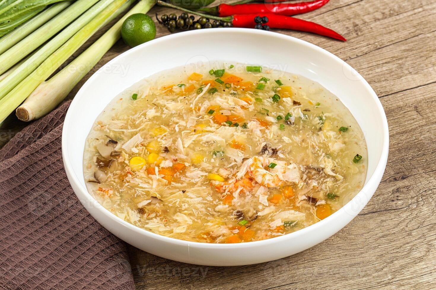 A bowl of soup with vegetables and other ingredients photo