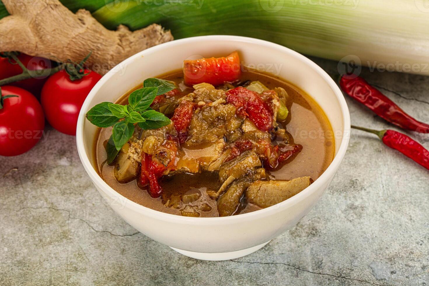 A bowl of stew with vegetables and spices photo
