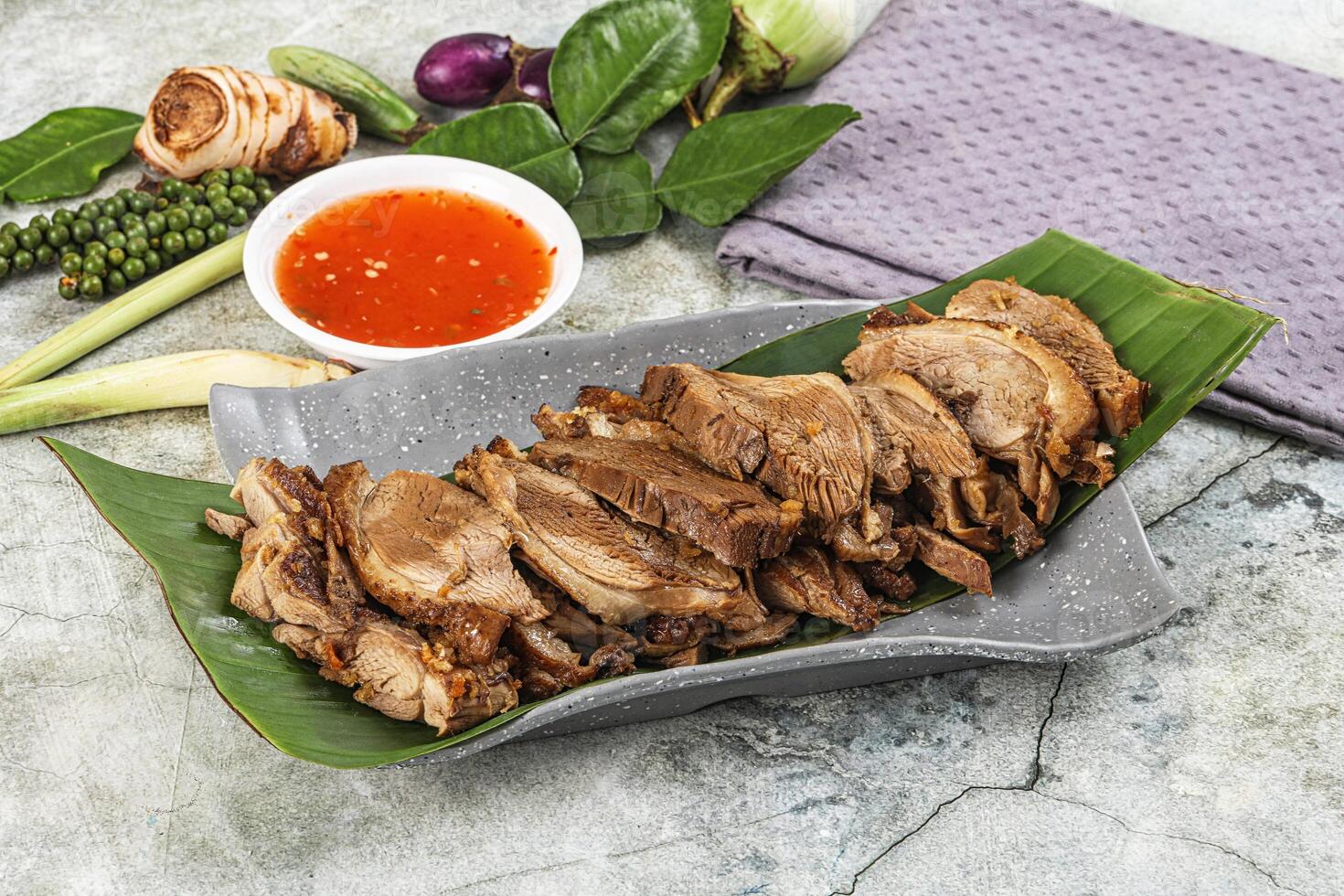 A plate with meat and vegetables on it photo