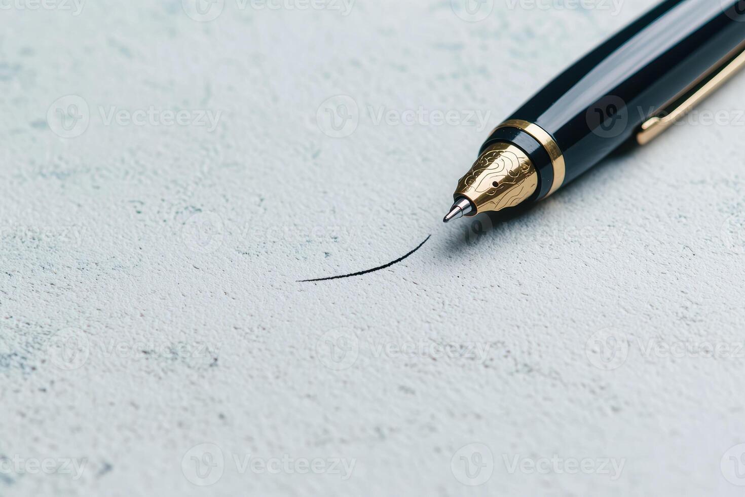 Close up of a fountain pen drawing a line on paper photo