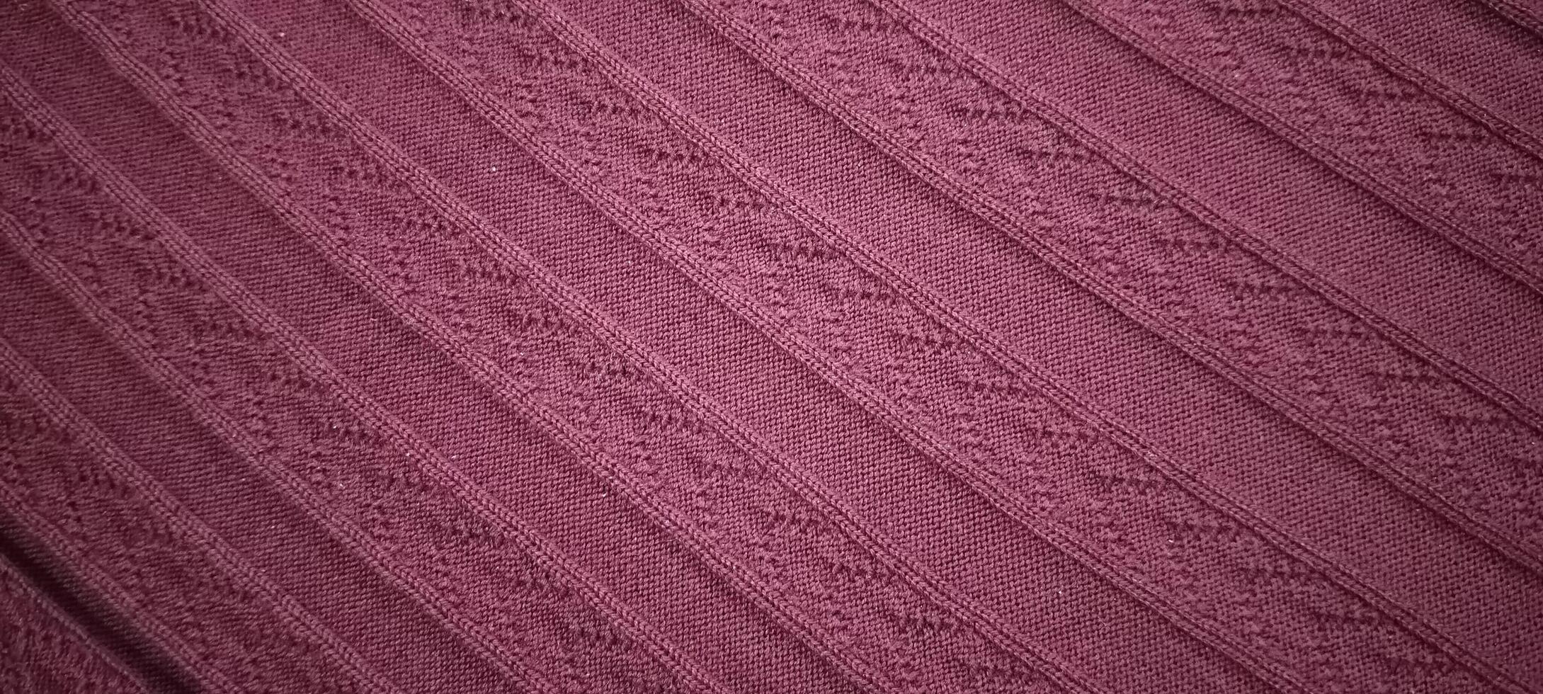 Textured Maroon Knitted Fabric with Elegant Diagonal Patterns photo