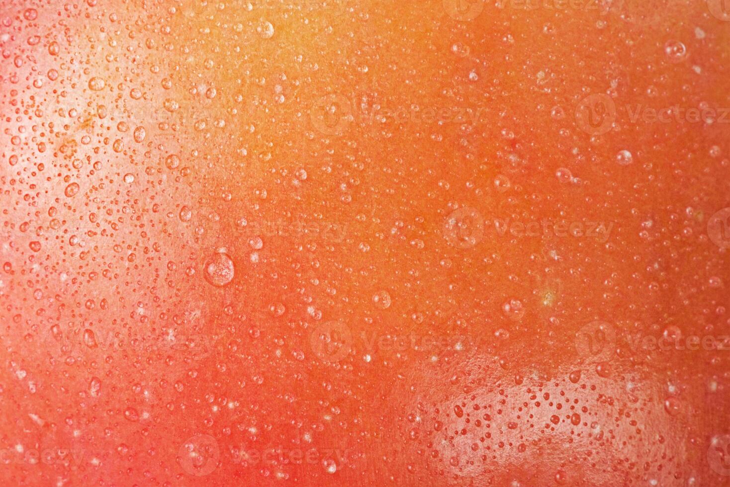 Red and yellow apples with water drops macro photo as a background. Fruit. Red apple peel.