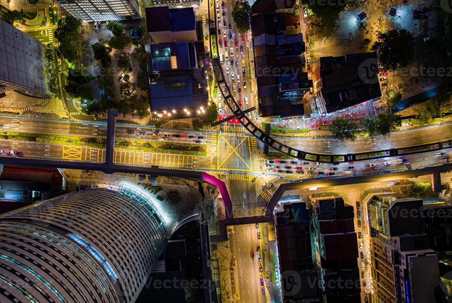 Aerial View Of Evening Traffic At Intersection In Kuala Lumpur, Malaysia. photo