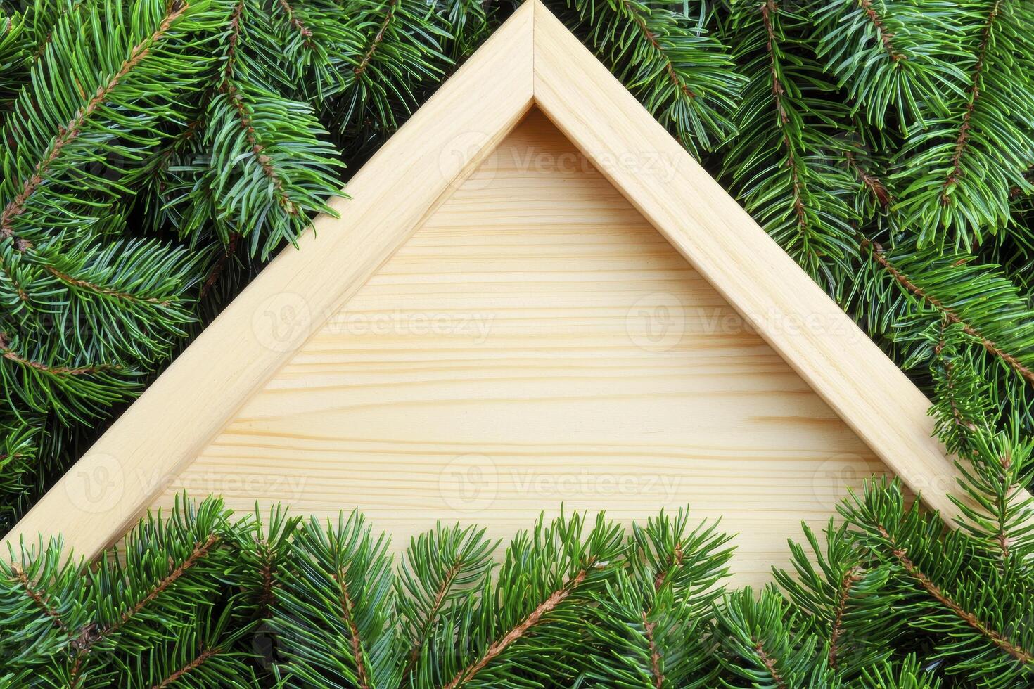 Wooden Frame Surrounded by Fresh Green Pine Branches on a Textured Background photo